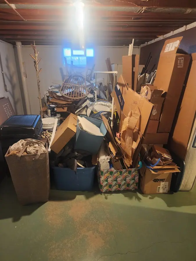 Roll-off dumpster container at job site for 4 Yard Dumpster Rental in Glocester